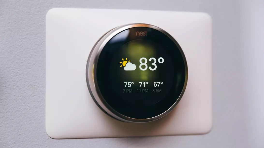 Nest smart thermostat installed cleanly on an interior wall